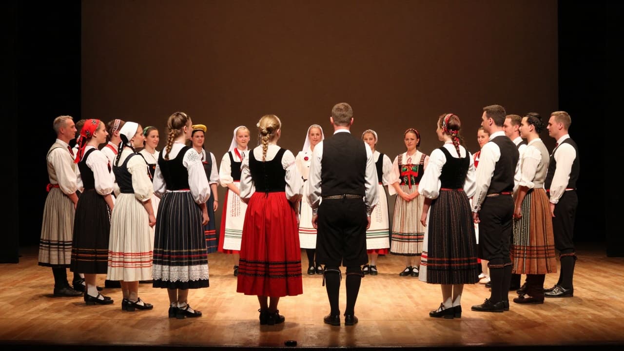 Folklorists in traditional costumes on stage