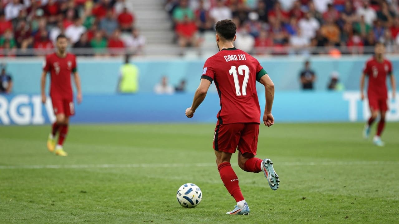 Young footballer in action wearing the jersey